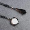 Pendentif en cristal de quartz fumé naturel avec Étoile de David et pointe, idéal pour la méditation et la protection énergétique.