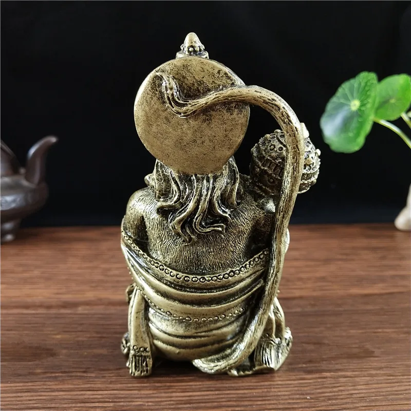 statue-hanuman-resine-bronze-arriere Vue arrière de la statue de Hanuman en résine couleur bronze, avec détails du dos et de la coiffe.