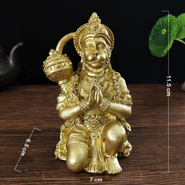 Statue de Hanuman en résine couleur or, mesurant 11,5 cm de hauteur et 7 cm de largeur, vue de face.